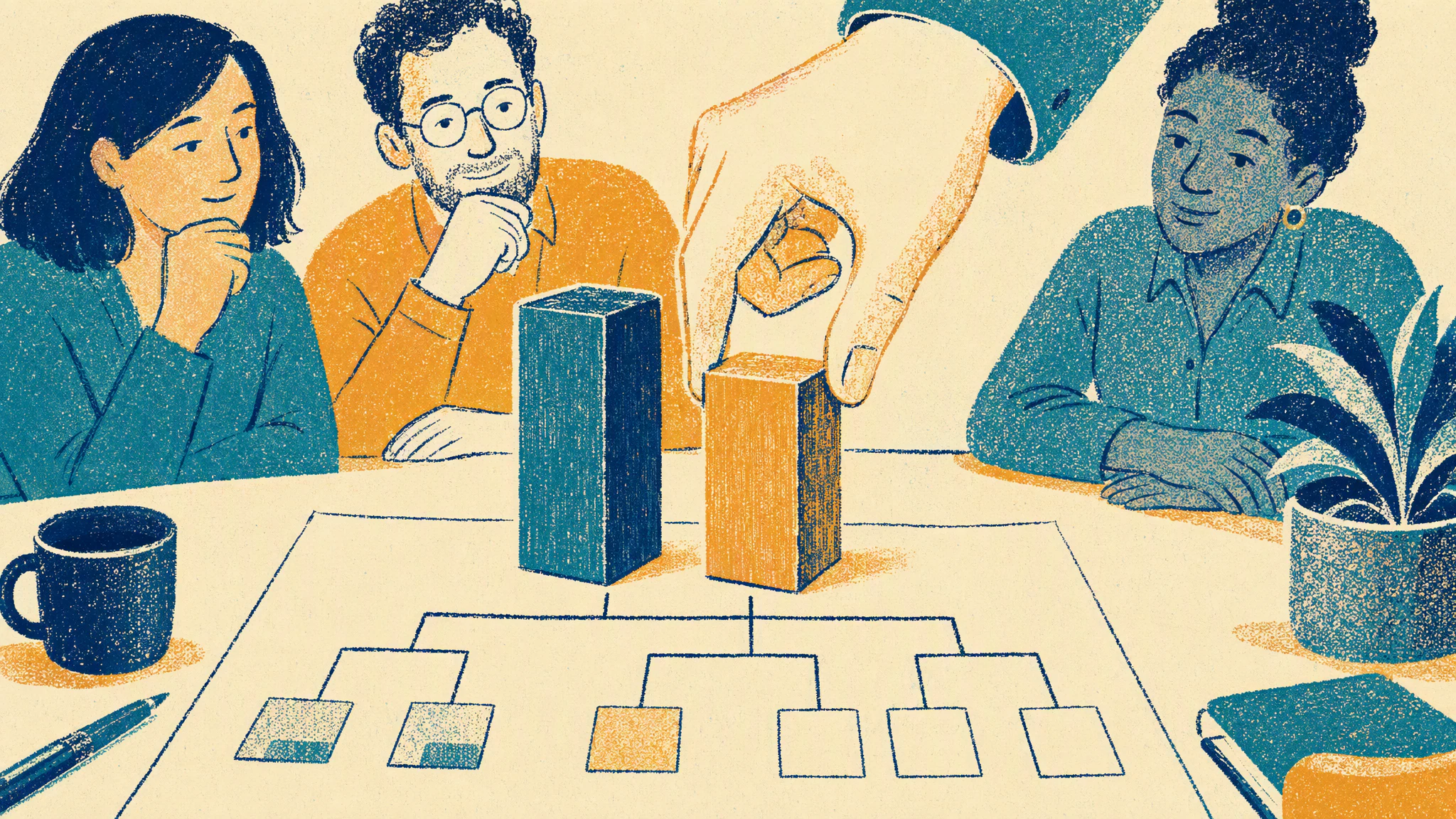 A hand sets a small second building block beside a larger one on a table covered in an org chart drawing.